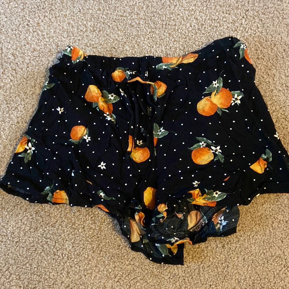 Black shorts with oranges design